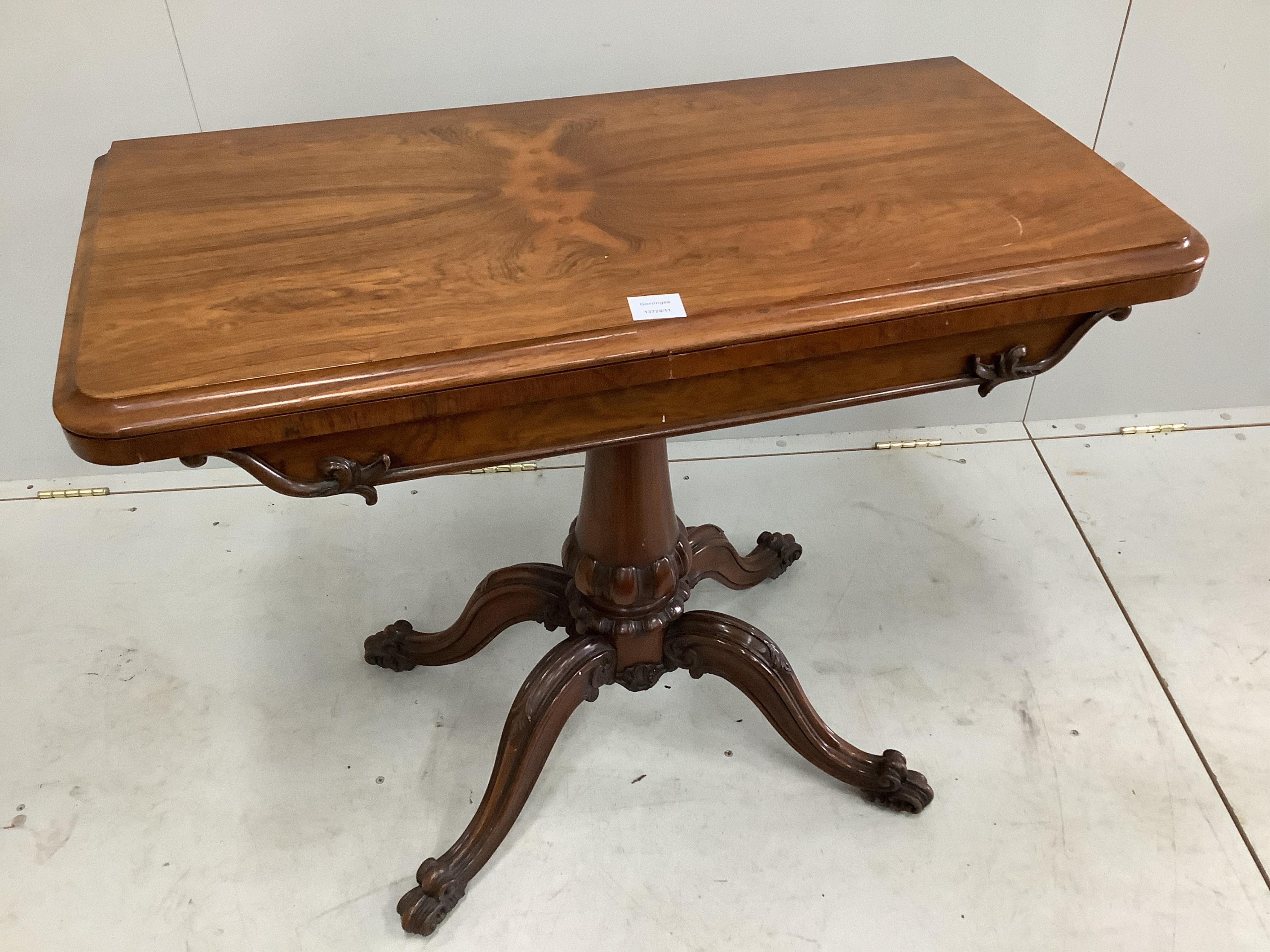 An early Victorian rosewood folding card table, width 92cm, depth 46cm, height 74cm. Condition - fair